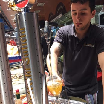 Bar Central - Our waiter pouring the cerveza - Mediterranean Near Me - Barcelona, B Bar Central - Our waiter pouring the cerveza - Mediterranean Near Me - Barcelona, B