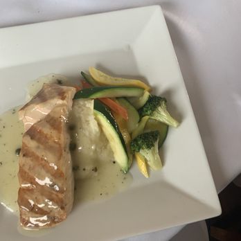 Cafe on the Green - **GRILLED SALMON Griled salmon, capers, garlic, fresh herbs served in a white wine sauce - Italian Near Me - Danbury, Connecticut Cafe on the Green - **GRILLED SALMON Griled salmon, capers, garlic, fresh herbs served in a white wine sauce - Italian Near Me - Danbury, Connecticut