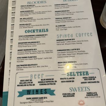 Pike Street - Menu - The menu from Pike Street Brunch includes sections for bloodies, bubblies, cocktails, spiked coffee, beers, wines, and sweets. It lists various drink options with prices, such as Bloody Mary, Mimosa, and specialty cocktails like Cinnamon Roll Latte. The menu also features beer choices, including dark horse cans and bottles, and wine options like Dark Horse wine. Sweets include milkshake and vanilla & chocolate options. The menu is printed on white paper with teal and black text, and a decorative logo at the bottom. - Diners Near Me - Covington, Kentucky