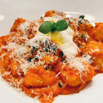 C Prime - a plate of pasta with cheese and parmesan - Italian Near Me - Vancouver, British Columbia