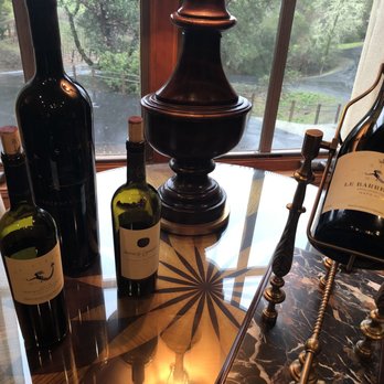 La Sirena - three bottles of wine on a glass table - Wineries Near Me - Calistoga, California La Sirena - three bottles of wine on a glass table - Wineries Near Me - Calistoga, California