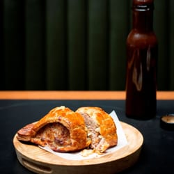 Homemade sausage roll with homemade brown sauce