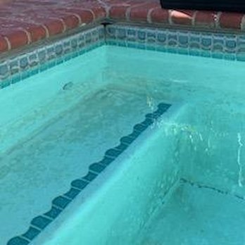 Modern Surfaces - a small child in a pool - General Contractors Near Me - Upland, California