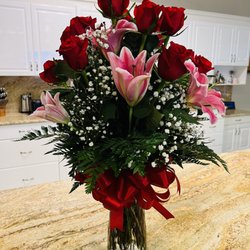 Sun City Center Flowers & Gifts - Stargazer Lillies and Red Roses.