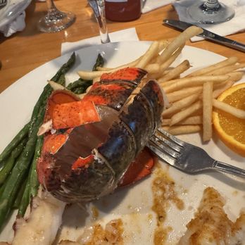 Bobby's Restaurant & Lounge - A half cooked lobster tail..... - Steakhouses Near Me - Vero Beach, Florida Bobby's Restaurant & Lounge - A half cooked lobster tail..... - Steakhouses Near Me - Vero Beach, Florida
