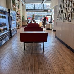 Tony & Petes Groceries & Coldcuts - Dining area & grocery shelves
