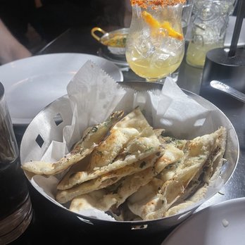 Tabla - Garlic naan. I always get this while eating here. Great to soak up sauces. - Indian Near Me - Atlanta, Georgia