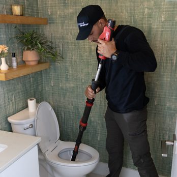 Grand Rooter - Grand Rooter plumber performing a auger toilet - Plumbing Near Me - Miramar, Florida Grand Rooter - Grand Rooter plumber performing a auger toilet - Plumbing Near Me - Miramar, Florida