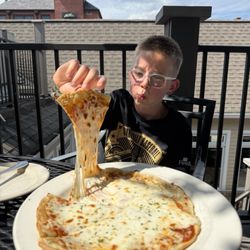 GF cheese pizza with the best cheese pull ever!