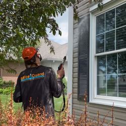 Elite Guard - Power washing a house