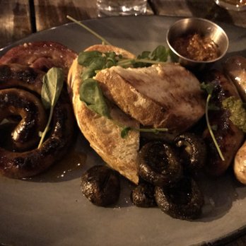 The Dawson - Chef's choice of tonight's meat sampler. Lamb sausage, pork belly, and chicken sausage all prepared over the spit. Amazing - American Near Me - Chicago, Illinois