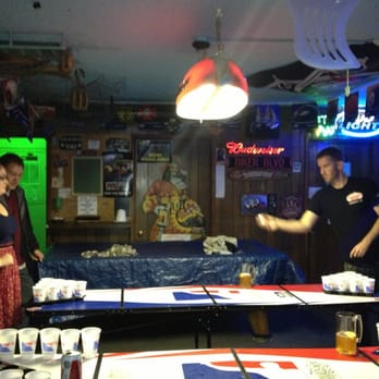 Morgan's Tavern - a man serving beer to a group of people - Dive Bars Near Me - Riverside, California Morgan's Tavern - a man serving beer to a group of people - Dive Bars Near Me - Riverside, California