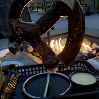 BIERmarkt - BierMarkt:  Beers & Pretzel on the patio by the fire table. - Beer, Wine & Spirits Near Me - North Bend, Ohio