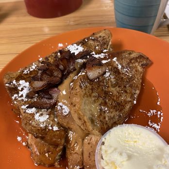 AJS Creekside Innn - Peanut butter and jelly French toast with powdered sugar and bacon bits on top with real butter on the side and syrup & coffee. - Breakfast & Brunch Near Me - Hot Springs, Montana AJS Creekside Innn - Peanut butter and jelly French toast with powdered sugar and bacon bits on top with real butter on the side and syrup & coffee. - Breakfast & Brunch Near Me - Hot Springs, Montana
