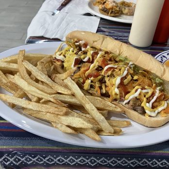 Anita's Restaurant - Chucos - fusion mega sandwich with guacamole, chopped hot dogs and steak, pickled veg, mustard mayo. The fries were awesome. - Mexican Near Me - Rockville, Maryland Anita's Restaurant - Chucos - fusion mega sandwich with guacamole, chopped hot dogs and steak, pickled veg, mustard mayo. The fries were awesome. - Mexican Near Me - Rockville, Maryland