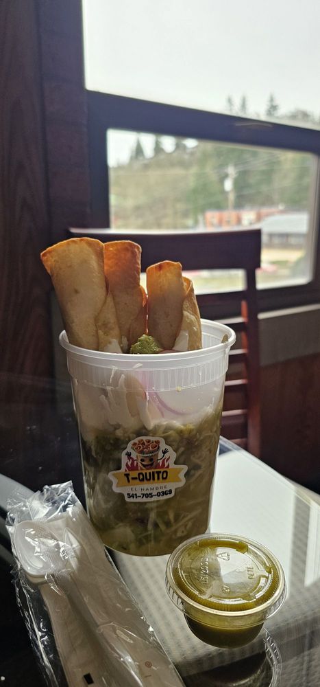 T-Quito El Hambre Logo