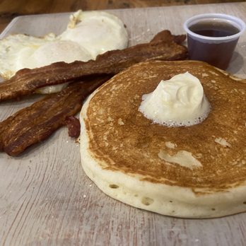 Crickles and Co - Buttermilk Pancake, bacon and 2 eggs over medium. - Breakfast & Brunch Near Me - Dallas, Texas Crickles and Co - Buttermilk Pancake, bacon and 2 eggs over medium. - Breakfast & Brunch Near Me - Dallas, Texas