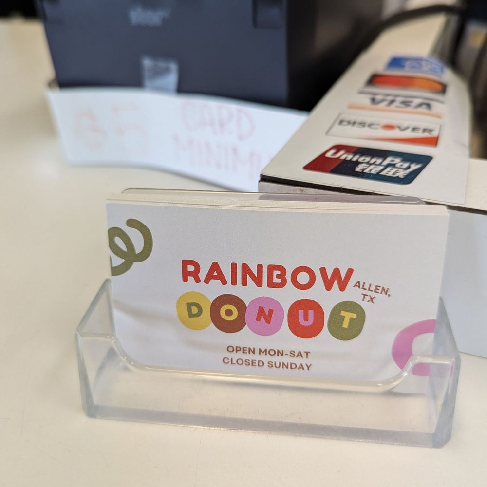 Rainbow Donut - a box of donuts on a table - Donuts Near Me - Allen, Texas Rainbow Donut - a box of donuts on a table - Donuts Near Me - Allen, Texas