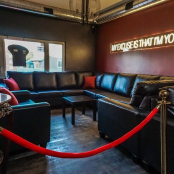 Karnak Cafe - a black leather couch and a red rope - Hookah Bars Near Me - Mississauga, Ontario