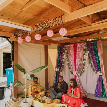 Dream Designs By Sherlly - Unqiue backdrop with indian pattern fabrics and flower vines as well as hanging rose balls - Florists Near Me Dream Designs By Sherlly - Unqiue backdrop with indian pattern fabrics and flower vines as well as hanging rose balls - Florists Near Me