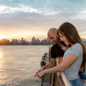 Remi Malca Photography - Sunset family photography in Williamsburg, overlooking the Manhattan skyline. A candid moment of wonder and connection. - Event Photography Near Me - Brooklyn, New York Remi Malca Photography - Sunset family photography in Williamsburg, overlooking the Manhattan skyline. A candid moment of wonder and connection. - Event Photography Near Me - Brooklyn, New York