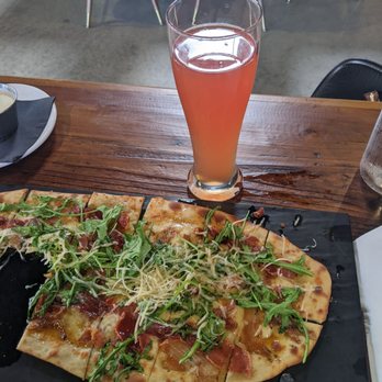 Finney's Crafthouse - Orange - Prosciutto and arugula pizza and blood Orange Heff!! - New American Near Me - Orange, California