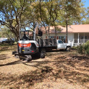 Williams Cleaning Service - Loading yard debris into dump truck. - Junk Removal & Hauling Near Me Williams Cleaning Service - Loading yard debris into dump truck. - Junk Removal & Hauling Near Me