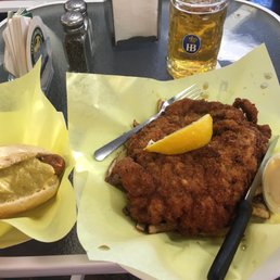 Wienerschnitzel with pommes, a Bratwurst, and Hofbrauhaus classic
