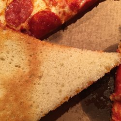 Middle of the pizza and crust under cooked and doughy.
