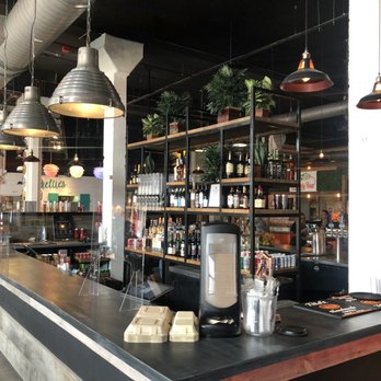 Center Bar - various bottles of alcohol on shelves - Bars Near Me - Fort Lauderdale, Florida