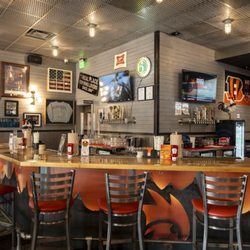 Golden Flame Hot Wings - Bar seating with sports bar vibe