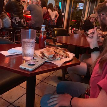 Cobra Cabana - A customer enjoying a vegan sandwich. - Bars Near Me - Richmond, Virginia