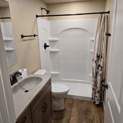 Blue Ladder Construction - Adding a bathroom to a basement remodel.