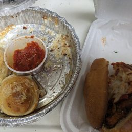 Rubbery Chicken Parm hero and tough garlic knots. The calzone is missing. Rubbery Chicken Parm hero and tough garlic knots. The calzone is missing.