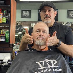 VIP Barbershop - Patrick putting after-shave after cut and beard trim.
