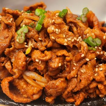 K-Kitchen - a plate of chicken with sesame seeds and scallions - Korean Near Me - Lacey, Washington