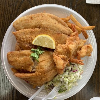 Bayseas Restaurant - Fry shrimp and tilapia served over fries and coleslaw salad. - Seafood Near Me - Universal City, Texas Bayseas Restaurant - Fry shrimp and tilapia served over fries and coleslaw salad. - Seafood Near Me - Universal City, Texas