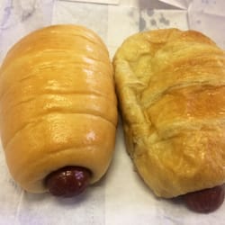 Large Pig in Blanket on left. Large Croissant w/ Sausage on right.