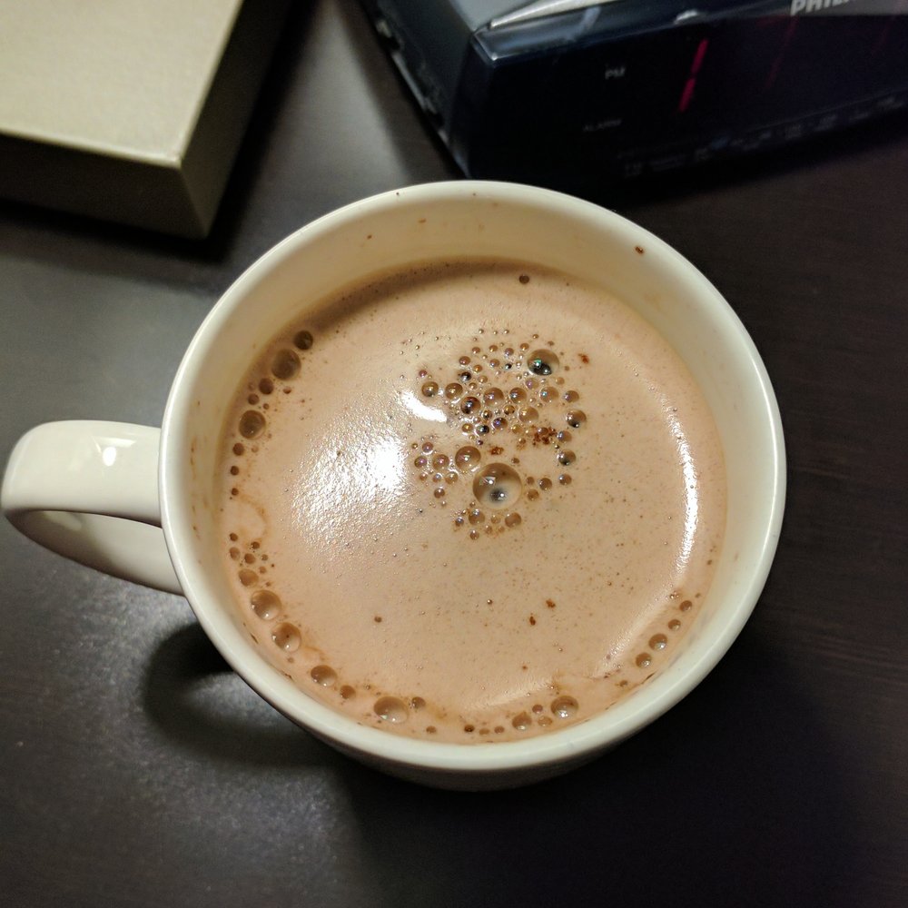 Enjoying a complimentary cup of hot chocolate before bedtime. Enjoying a complimentary cup of hot chocolate before bedtime.