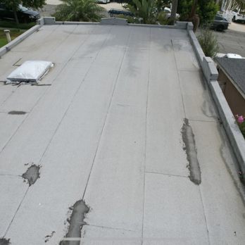 NEMA Roofing Solutions - Old roof that was replaced. With my attempts to patch and sheeting over my skylight due to so many leaks - Roofing Near Me - Oxnard, California