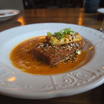 Puritan & Company - Calamari - on a crispy potato bed, with a mildly spicy sauce - New American Near Me - Cambridge, Massachusetts