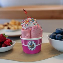 Rock And Roll Ice Cream Parlor - Strawberry roll icecream topped with rainbow sprinkles and whipped cream.