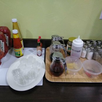 Kainan Sa Laguna - Condiments with fish sauce, vinegar, peppers, soy sauce, hot sauce, etc - Filipino Near Me - Plano, Texas