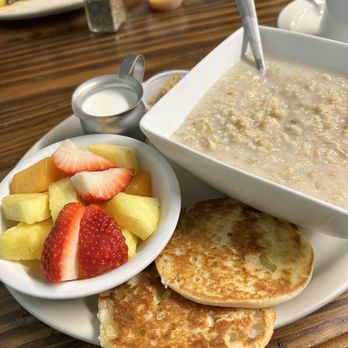Cowboys Restaurant - Oatmeal, brown sugar & milk with fresh fruit and toasted English muffin. - American Near Me - Lake Dallas, Texas Cowboys Restaurant - Oatmeal, brown sugar & milk with fresh fruit and toasted English muffin. - American Near Me - Lake Dallas, Texas