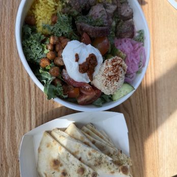 Nick the Greek - Mediterranean bowl with beef souvlaki and a side of pita. - Salad Near Me - Ontario, California Nick the Greek - Mediterranean bowl with beef souvlaki and a side of pita. - Salad Near Me - Ontario, California