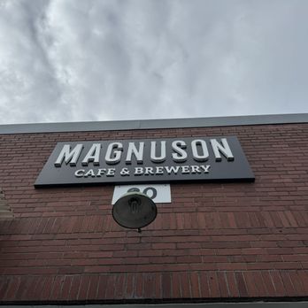 Magnuson Cafe & Brewery - sign on brick building - Brewpubs Near Me - Seattle, Washington
