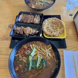Luo si fen with fried egg, crispy pork, and intestine