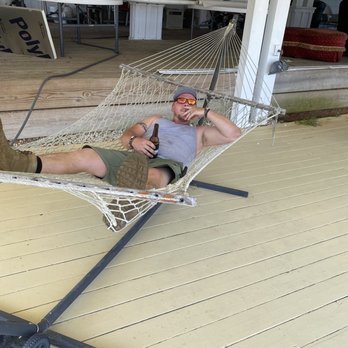 Mountain Harbor Inn - My husband in the hammock they have on the balcony. - Hotels Near Me - Dandridge, Tennessee Mountain Harbor Inn - My husband in the hammock they have on the balcony. - Hotels Near Me - Dandridge, Tennessee