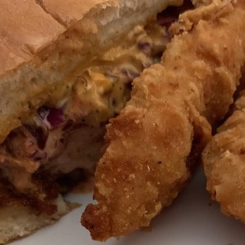 Chick N' Bros - Closeup of halved Angry Bird Deluxe Sandwich and Chick N' Tenders with Fries - Food Trucks Near Me Chick N' Bros - Closeup of halved Angry Bird Deluxe Sandwich and Chick N' Tenders with Fries - Food Trucks Near Me