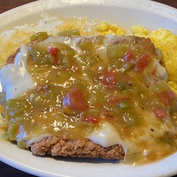 CFS with white gravy and green chile "boss style". Hash browns and eggs. Great deal and very good.